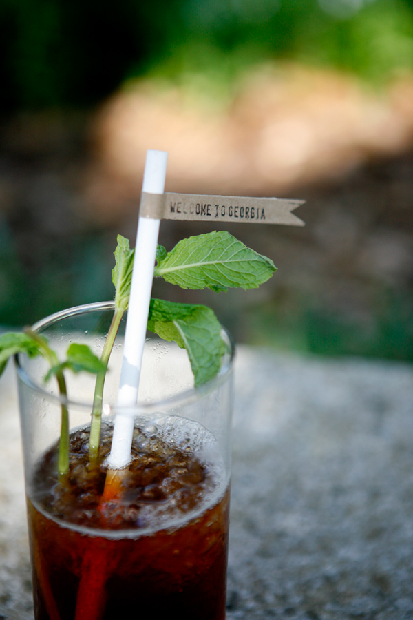 pretty wedding cocktail with straw and paper flag - wedding photo by Belathee Photography